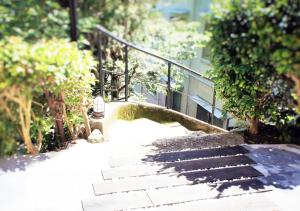 a set of stairs leading up to a building at ATAMI SPRING TERRACE HOTEL in Atami