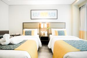 Postel nebo postele na pokoji v ubytování Belmont Hotel Boracay