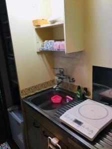 a kitchen counter with a sink and a sink at ROOMs六本松03 in Fukuoka