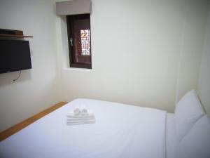 Postel nebo postele na pokoji v ubytování 沐光獨棟館