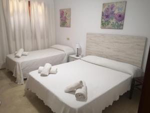 Кровать или кровати в номере Casa rural isleña