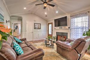 a living room with a couch and a fireplace at Bluffton Getaway Fenced Yard, 7 Mi to Beach! in Bluffton