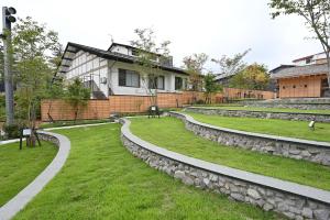 a group of stone steps in front of a building at Ryokan Tamura in Kusatsu