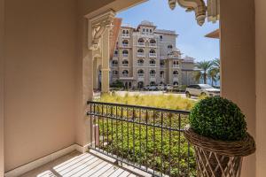 a balcony with a view of a large building at HiGuests - Luxurious 1BR in Palms with Private Beach Access in Dubai