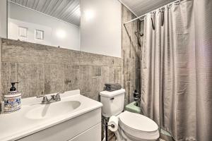 a bathroom with a sink and a toilet and a shower at Game Room, Fire Pit and Deck Spacious Poconos Home! in Lake Harmony +29 photos