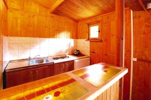 A kitchen or kitchenette at Bungalow in Mielno in a beautiful setting