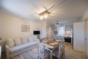 a living room with a couch and a table at The Beach House-Valley of love in Episkopos