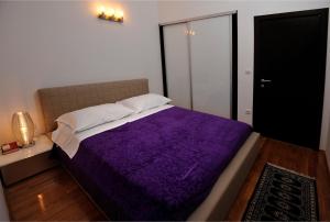 Postel nebo postele na pokoji v ubytování Marina