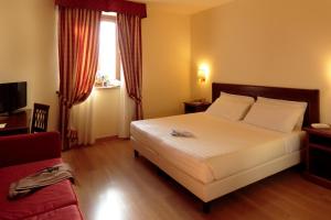 Postel nebo postele na pokoji v ubytování Giotto B&B