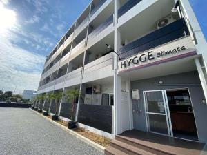 a large building with plants on the side of it at HYGGE Biimata in Nago