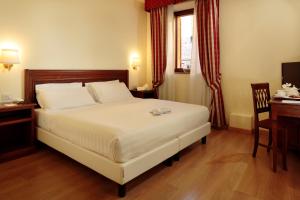 Postel nebo postele na pokoji v ubytování Giotto B&B