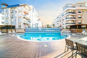 a swimming pool in the middle of a building at Flamingo Residence in Antalya