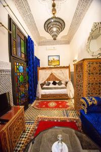 Un ou plusieurs lits dans un hébergement de l'établissement Riad Ghita Palace