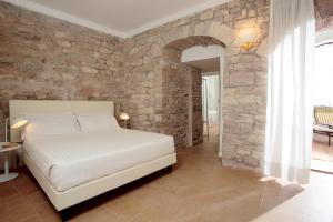 Postel nebo postele na pokoji v ubytování Giotto B&B