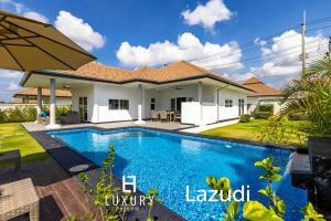 a swimming pool in the backyard of a house at Modern 3 Bedroom Pool Villa MS24 in Hua Hin