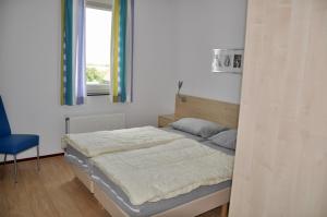 Postel nebo postele na pokoji v ubytování Duinerei appartement B203