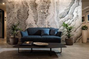 a living room with a couch and a table at Amery House in Sliema