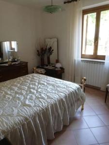 Llit o llits en una habitació de Casa-Vacanze I Vecchi Valori Umbria