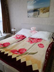 Una cama o camas en una habitación de Apartament Sova