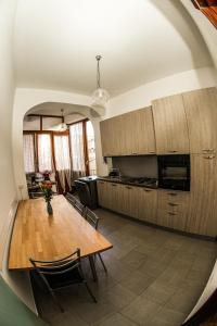 a kitchen and dining room with a table in a room at Araba Fenice in Reggio Calabria