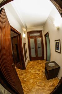 a view of a hallway with a door and a table at Araba Fenice in Reggio Calabria