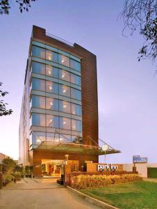 a tall building with a lot of windows at Park Inn Gurgaon in Gurgaon