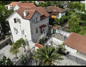 an aerial view of a house with a palm tree at Holiday Home Bogumila in Risan