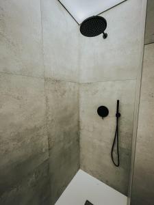 a bathroom with a shower with a shower head at Apartamenty Boszkowo Lake Harbor in Boszkowo