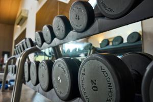 a row of dumbbells on a rack in a gym at Peebles Hydro in Peebles