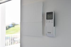 a remote control is attached to a wall at Villa Caravaggio Comfort e Relax in Rocca San Giovanni