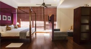 Voodi või voodid majutusasutuse Colombo Court Hotel & Spa toas