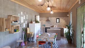 a kitchen with a table and a dining room at Camping 3 Gs in Goghtʼ