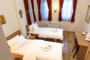 Postel nebo postele na pokoji v ubytování Guest Mansion, Гостински Палат