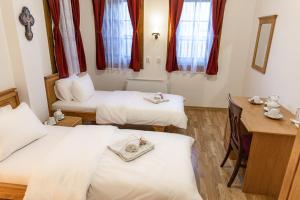 Postel nebo postele na pokoji v ubytování Guest Mansion, Гостински Палат
