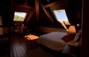 a bedroom with a bed and two windows in a cabin at Ca Don Rafel in Castanesa +47 photos