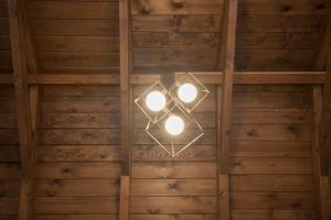 a chandelier hanging from the ceiling of a room at PanoramiKos in Asfendioú