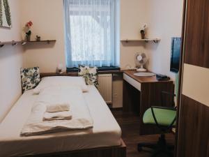 Postel nebo postele na pokoji v ubytování Hotel Horse Riding - Jezdecký Areál Tršice