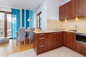 Kuchyň nebo kuchyňský kout v ubytování Villa 4 Pory Roku by Noclegi Renters