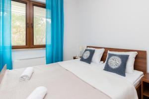 Postel nebo postele na pokoji v ubytování Villa 4 Pory Roku by Noclegi Renters