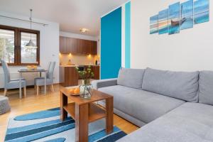 Posezení v ubytování Villa 4 Pory Roku by Noclegi Renters