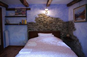 A bed or beds in a room at Erebia Appartamenti Vacanza