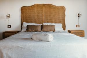A bed or beds in a room at La pagliera