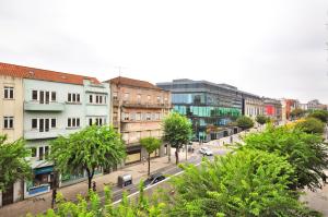 a view of a city street with buildings and trees at RH Charming Apartment Liberdade I in Braga