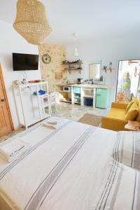 A bed or beds in a room at Ravi Boutique Home - 1 minute walk from beach