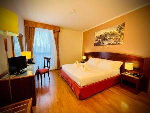 Postel nebo postele na pokoji v ubytování Hotel Hermitage