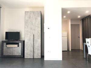 Televízia a/alebo spoločenská miestnosť v ubytovaní Casa Ginevra a Cecina by Zoom In Earth