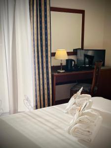 Postel nebo postele na pokoji v ubytování Hotel Hermitage