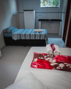 מיטה או מיטות בחדר ב-Pousada Alto de Junqueira