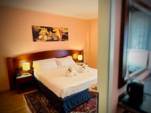 Postel nebo postele na pokoji v ubytování Hotel Hermitage