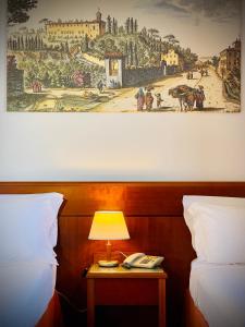 Postel nebo postele na pokoji v ubytování Hotel Hermitage